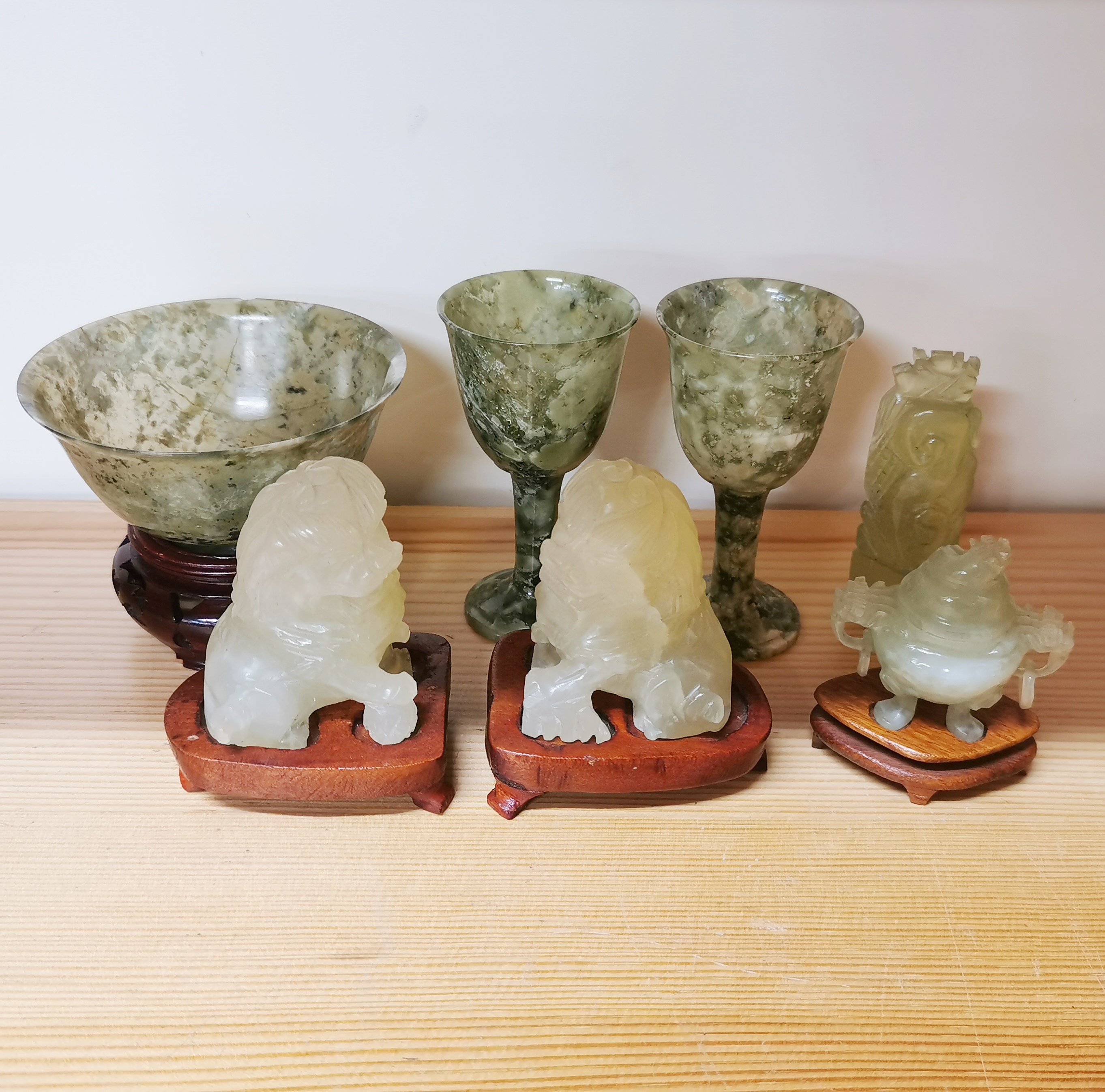 A group of Chinese spinach jade and other jade items. Stem cup H. 9cm.