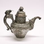 A Tibetan silver plated butter tea pot, H. 20cm L. 27cm.