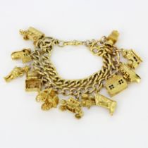 A 9ct yellow gold charm bracelet, L. 18cm.