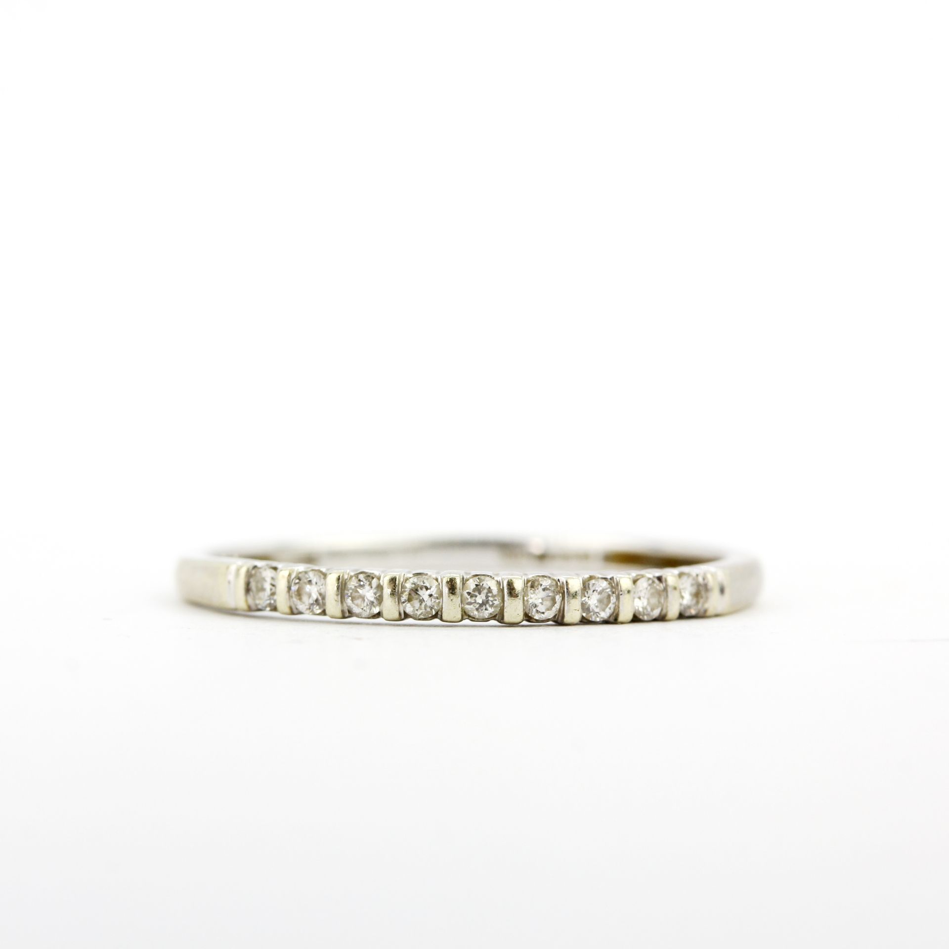 A 9ct white gold diamond set half eternity ring, (P.5). - Image 2 of 3