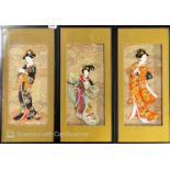 Three framed Japanese silk relief dolls, 27 x 59cm.
