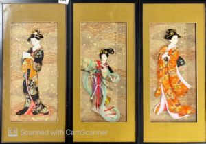 Three framed Japanese silk relief dolls, 27 x 59cm.