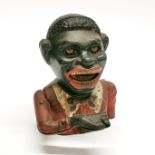 An old cast iron black boy money box, H. 16cm.