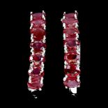 A pair of 925 silver earrings set with oval cut rubies, L. 2.4cm.