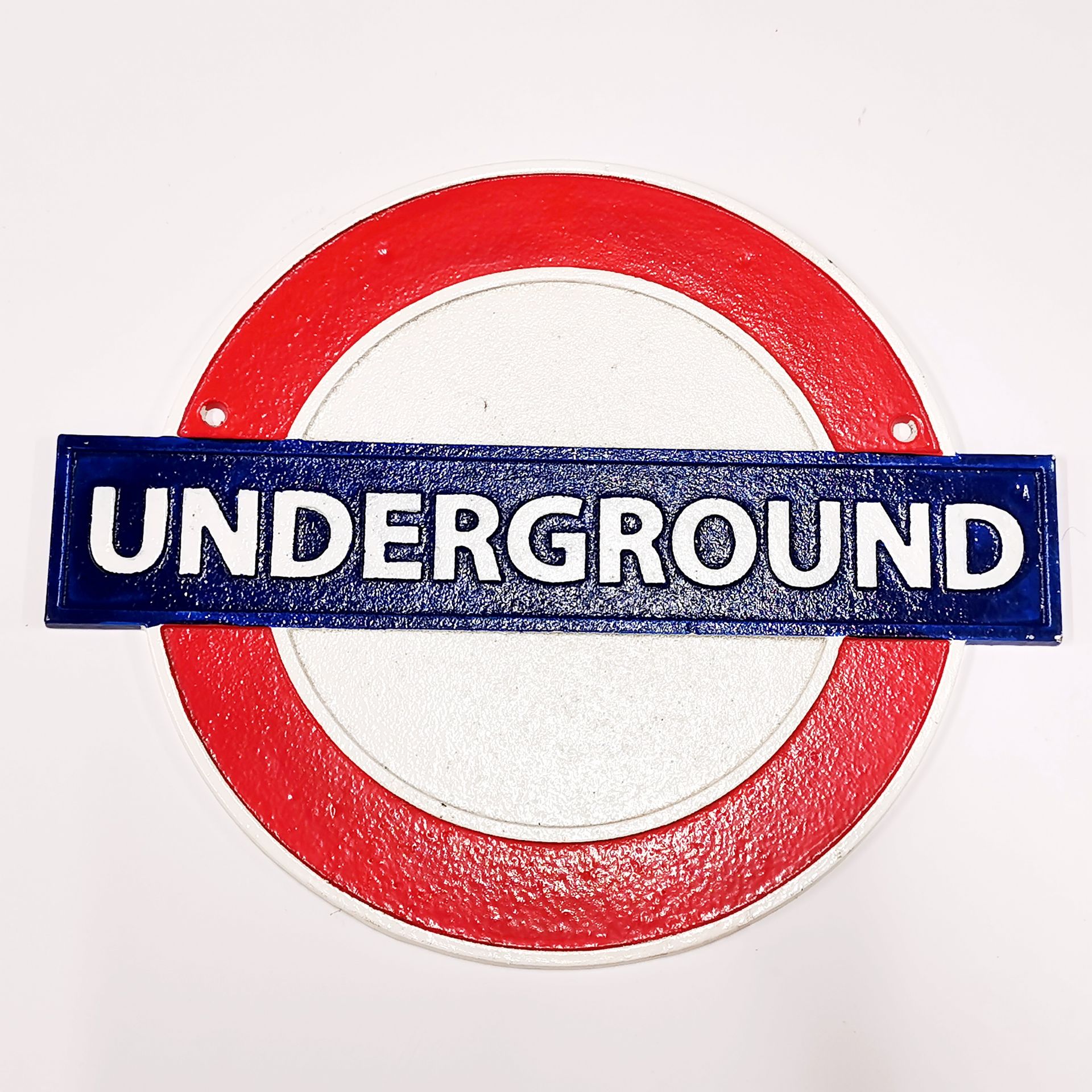 A painted cast metal underground sign, width 30cm.