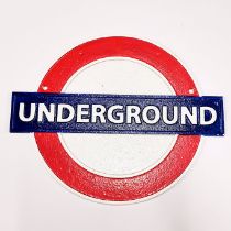 A painted cast metal underground sign, width 30cm.