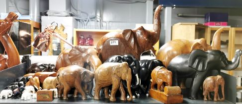 A large group of carved wooden elephants, tallest 44cm.