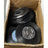 A box containing approx. three hundred 45-RPM single records from the 50's to the 80's.