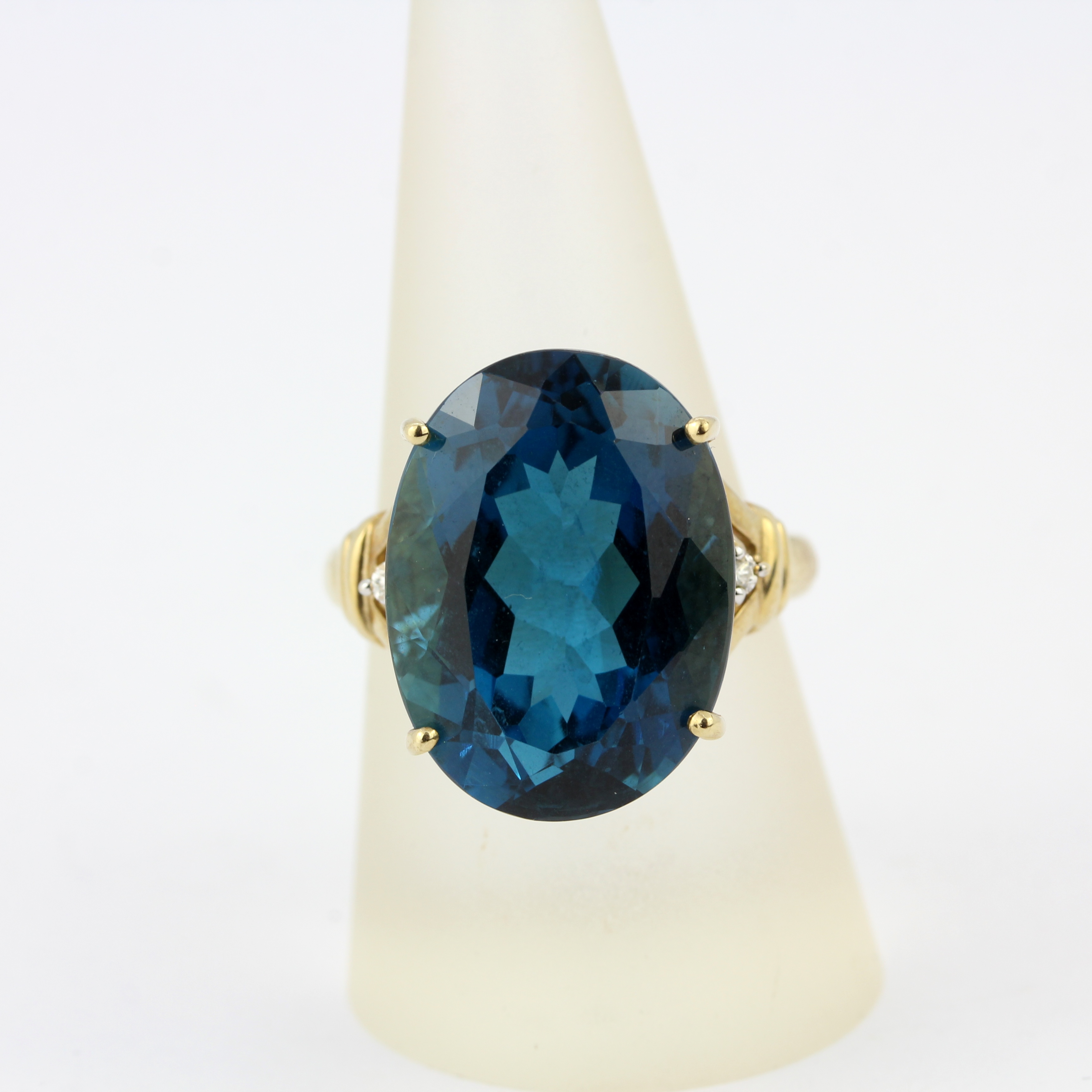 A 9ct yellow gold ring set with a large blue topaz and diamonds, ring size R.5. - Image 3 of 4