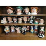 A large group of mixed Royal Doulton and other character jugs.