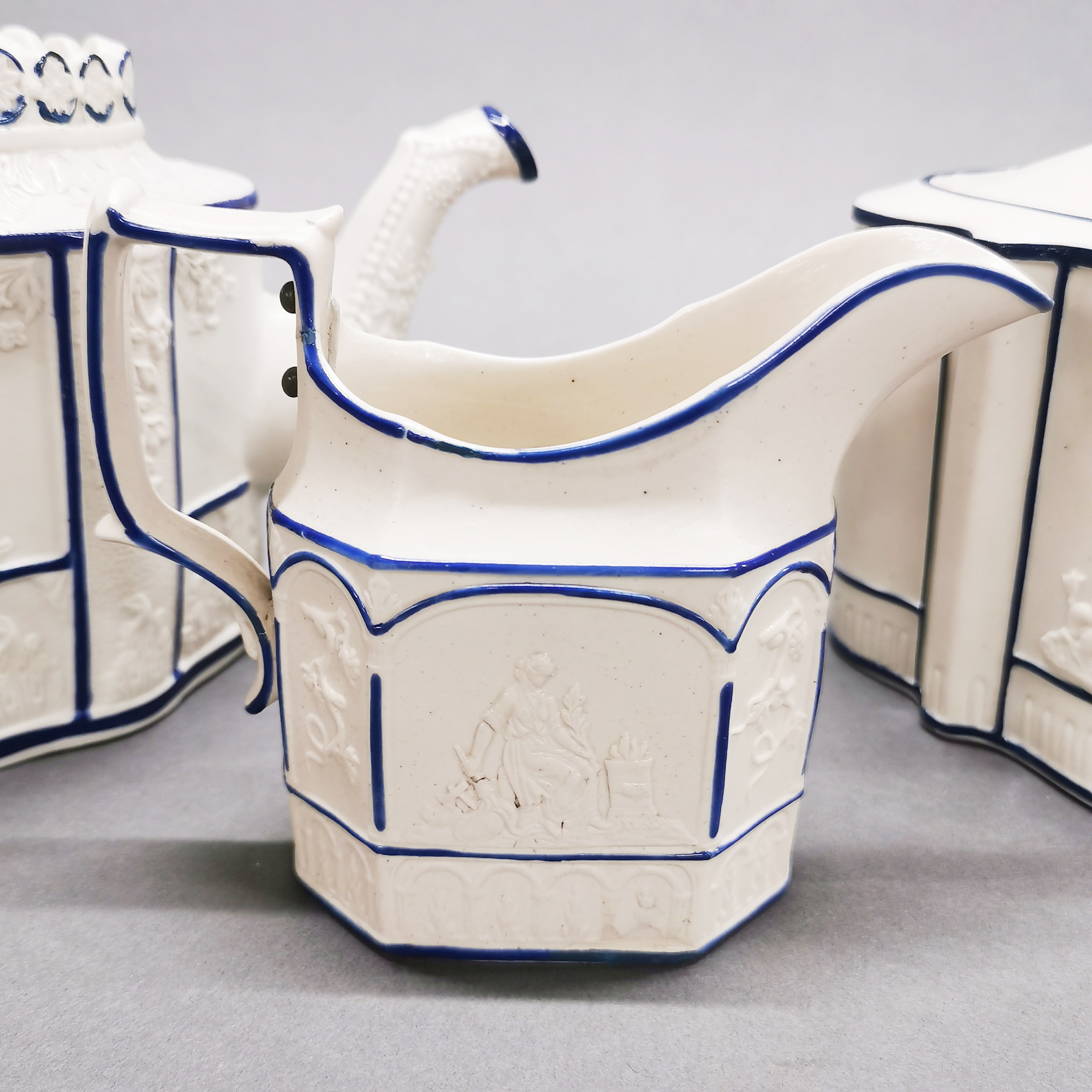An early 19thC three piece tea set in classical design, tea pot H. 16cm. Stud repair to jug handle - Image 2 of 7