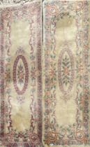 A pair of oblong Chinese wool rugs, 210 x 70cm.