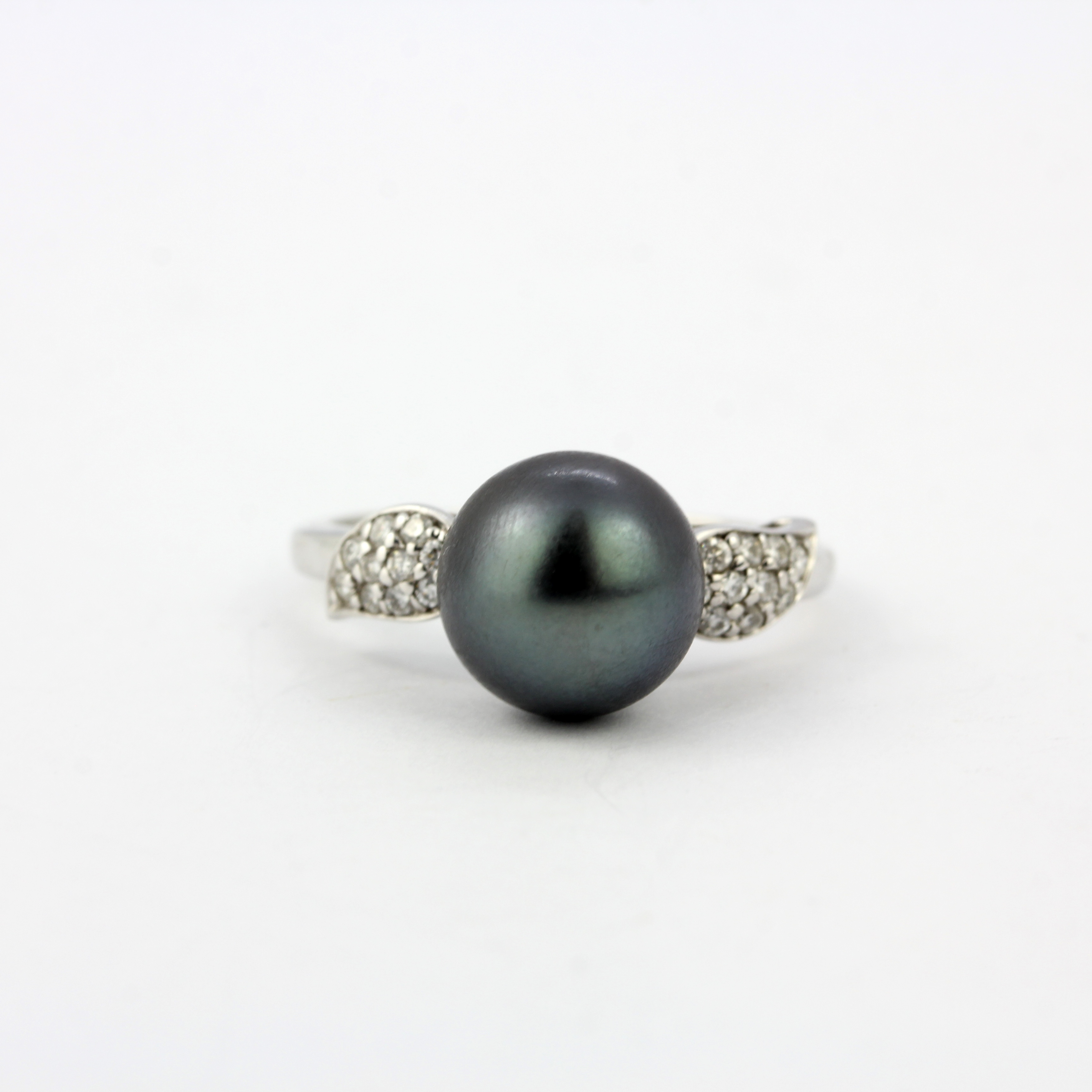 A 9ct white gold ring set with a black Tahitian pearl and diamond set shoulders, ring size S.5.