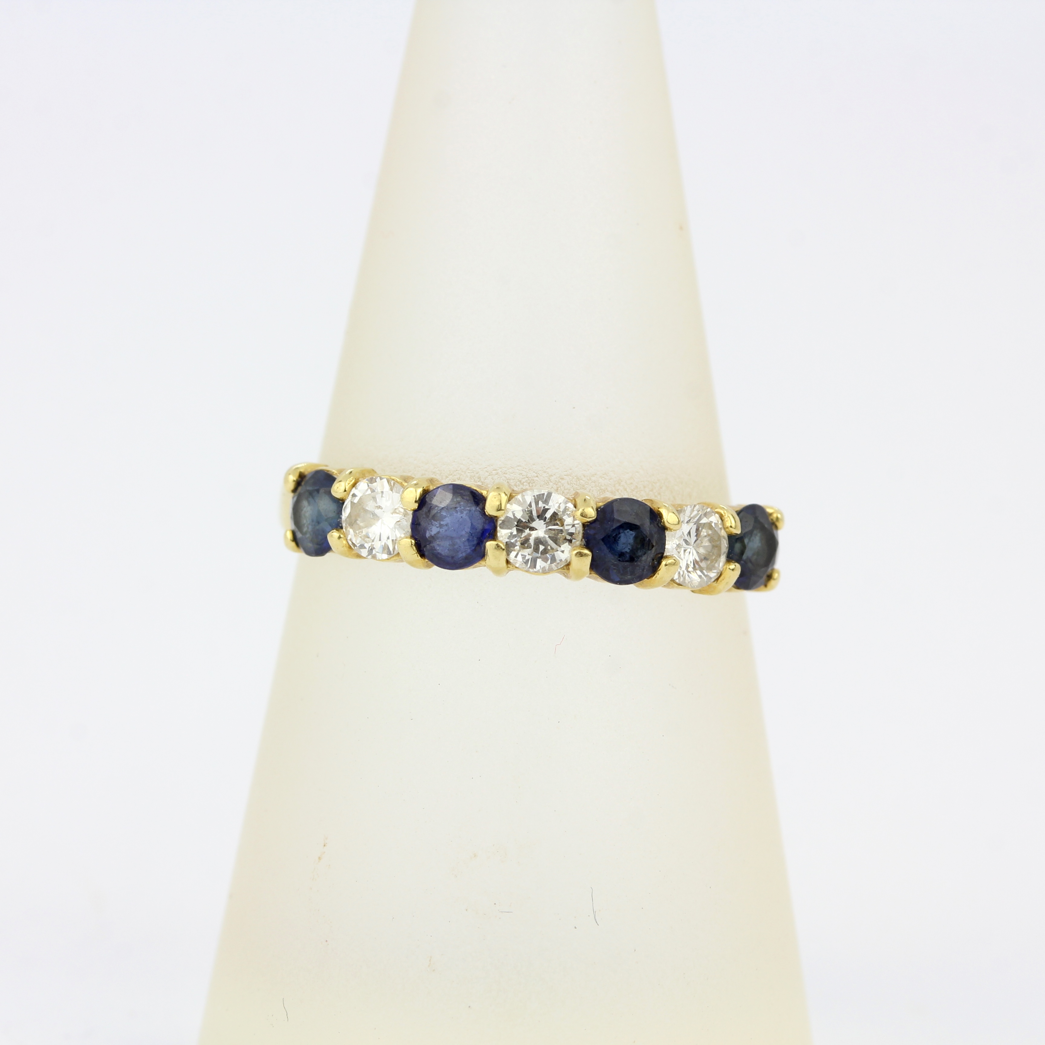 A 9ct yellow gold (tested,, worn hallmark) sapphire and diamond half eternity ring, approx. 0.