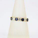 A 9ct yellow gold (tested,, worn hallmark) sapphire and diamond half eternity ring, approx. 0.