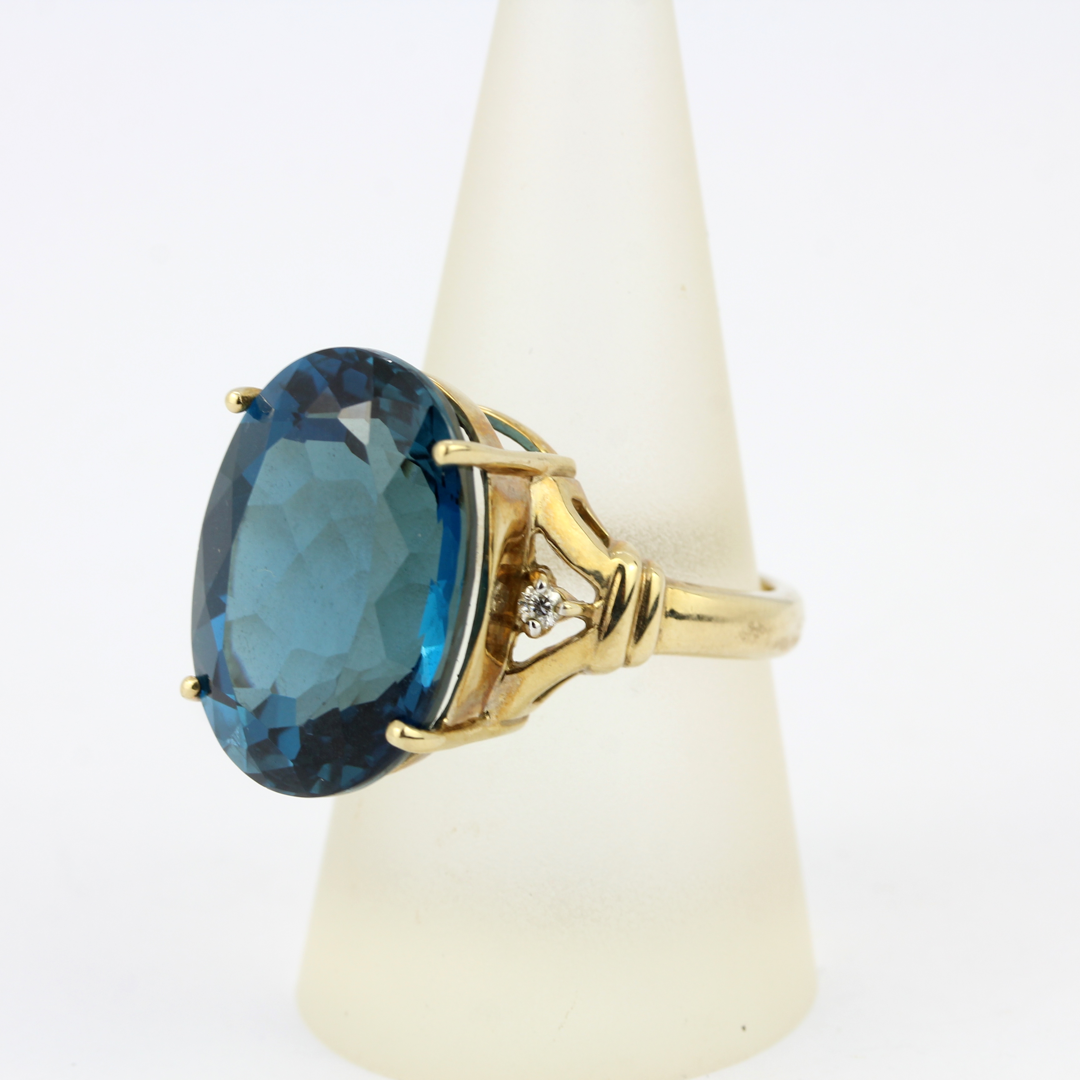 A 9ct yellow gold ring set with a large blue topaz and diamonds, ring size R.5. - Image 4 of 4