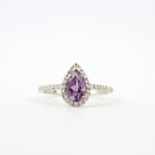 A 9ct white gold ring set with a pear cut amethyst and diamonds, ring size N.