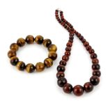 A tiger's eye graduated necklace together with a tiger's eye expandable bracelet.