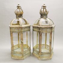 A pair of metal and glass garden lanterns, H. 62cm.