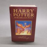 A first edition sealed hardback Harry Potter and the Order of the phoenix novel.