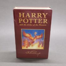 A first edition sealed hardback Harry Potter and the Order of the phoenix novel.