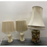 A vintage pebble table lamp with two onyx table lamps.
