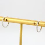 A pair of 18ct white gold diamond set hoop earrings, L. 1.3cm.