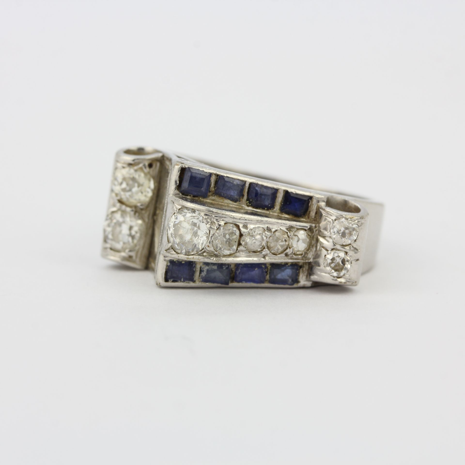 A white metal (tested minimum 9ct gold) ring set with step cut sapphires and old brilliant cut - Image 4 of 4