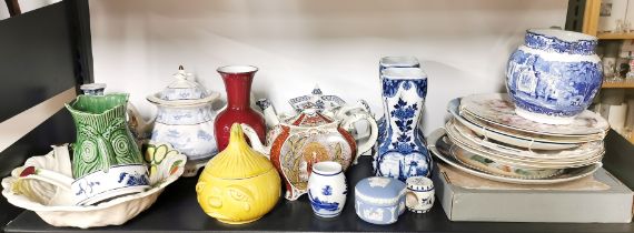 A group of tea pots and other china items.