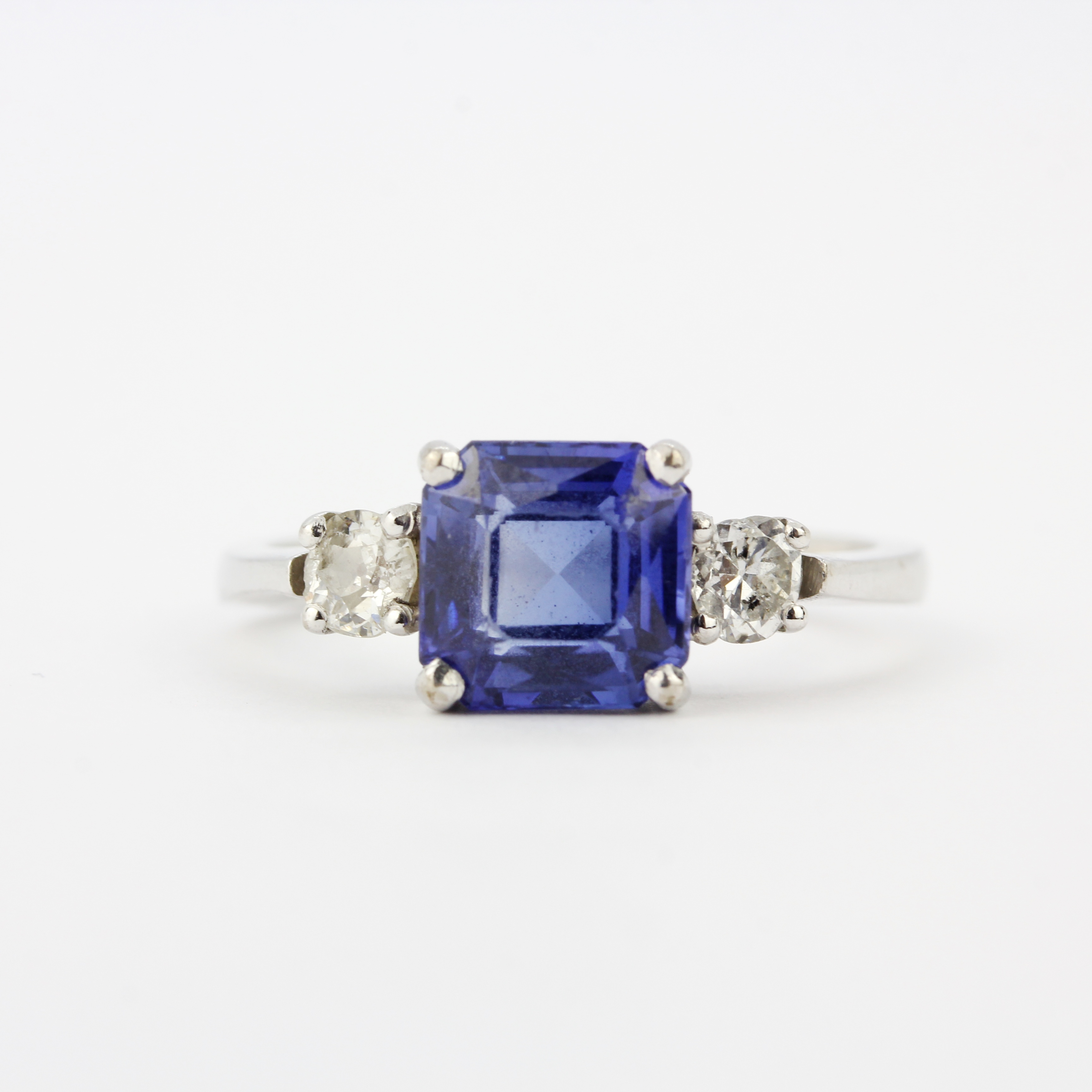 An 18ct white gold ring set with a fancy cut sapphire flanked by brilliant cut diamonds, diamonds - Image 3 of 4