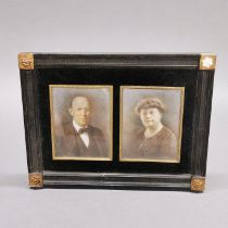 An early 20thC photo frame containing hand tinted photographs of a lady and gentleman, frame size.