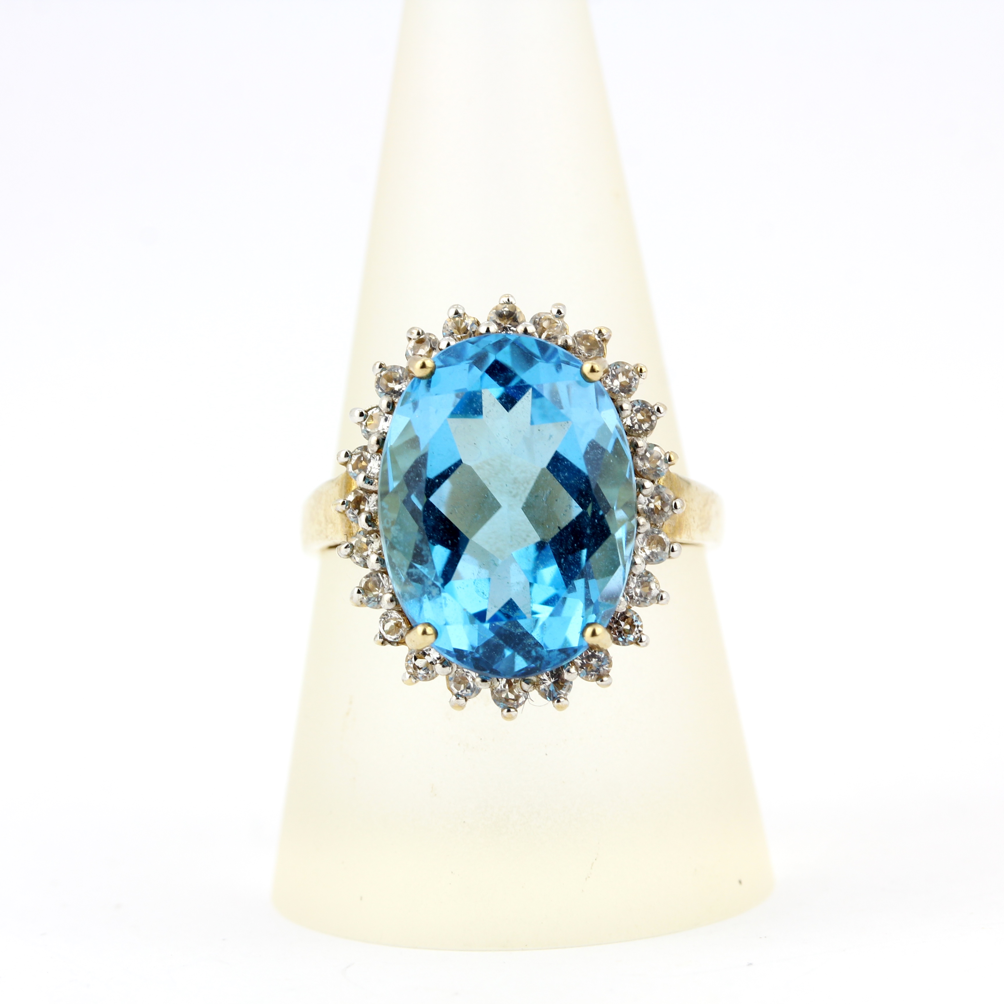 A 9ct yellow gold blue topaz and white topaz cluster ring, ring size S.