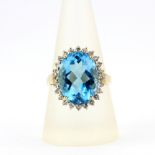 A 9ct yellow gold blue topaz and white topaz cluster ring, ring size S.