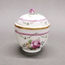 A 19thC Furstenberg porcelain pot and cover, H. 12cm.