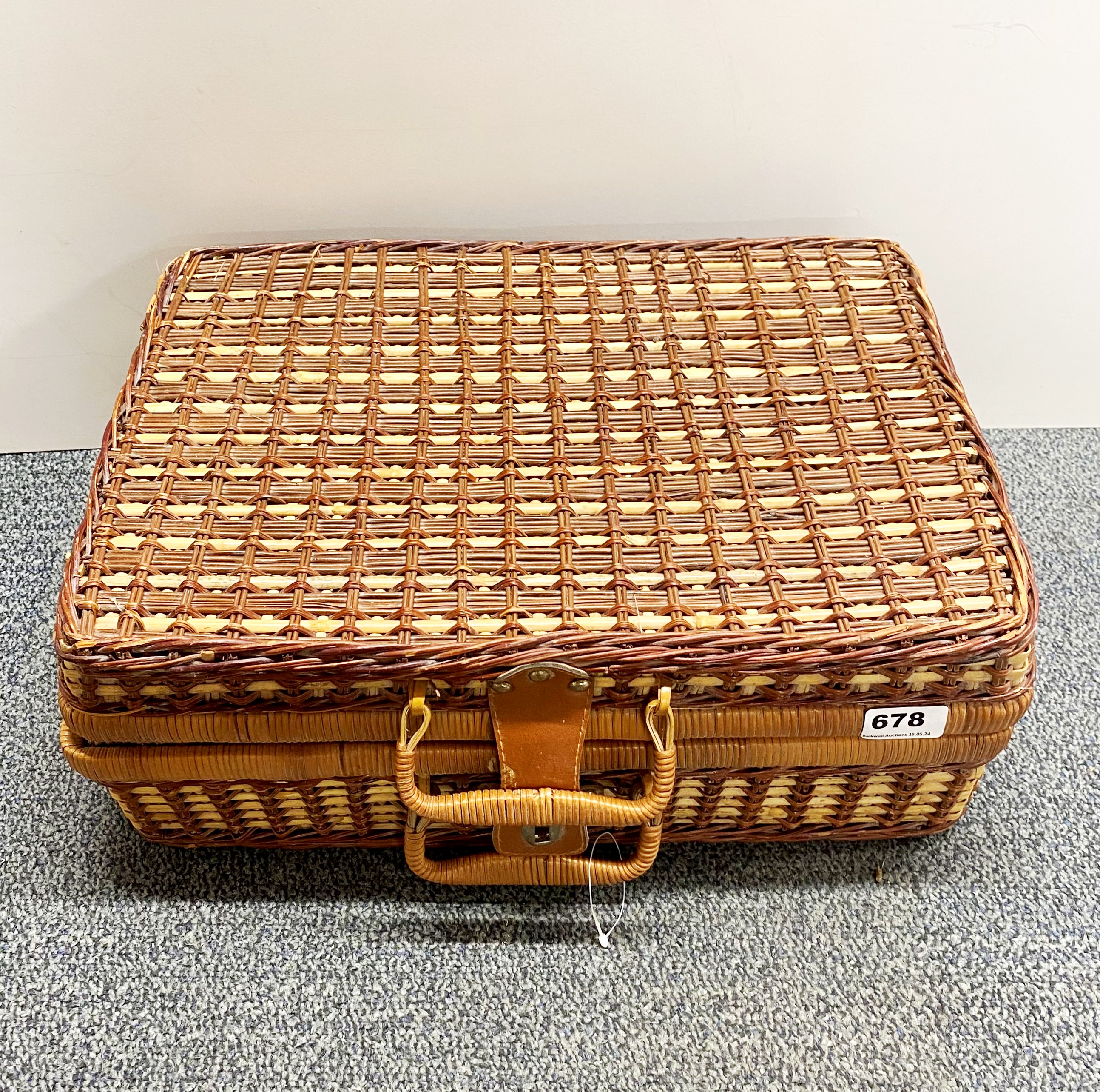 A vintage picnic hamper and original contents.