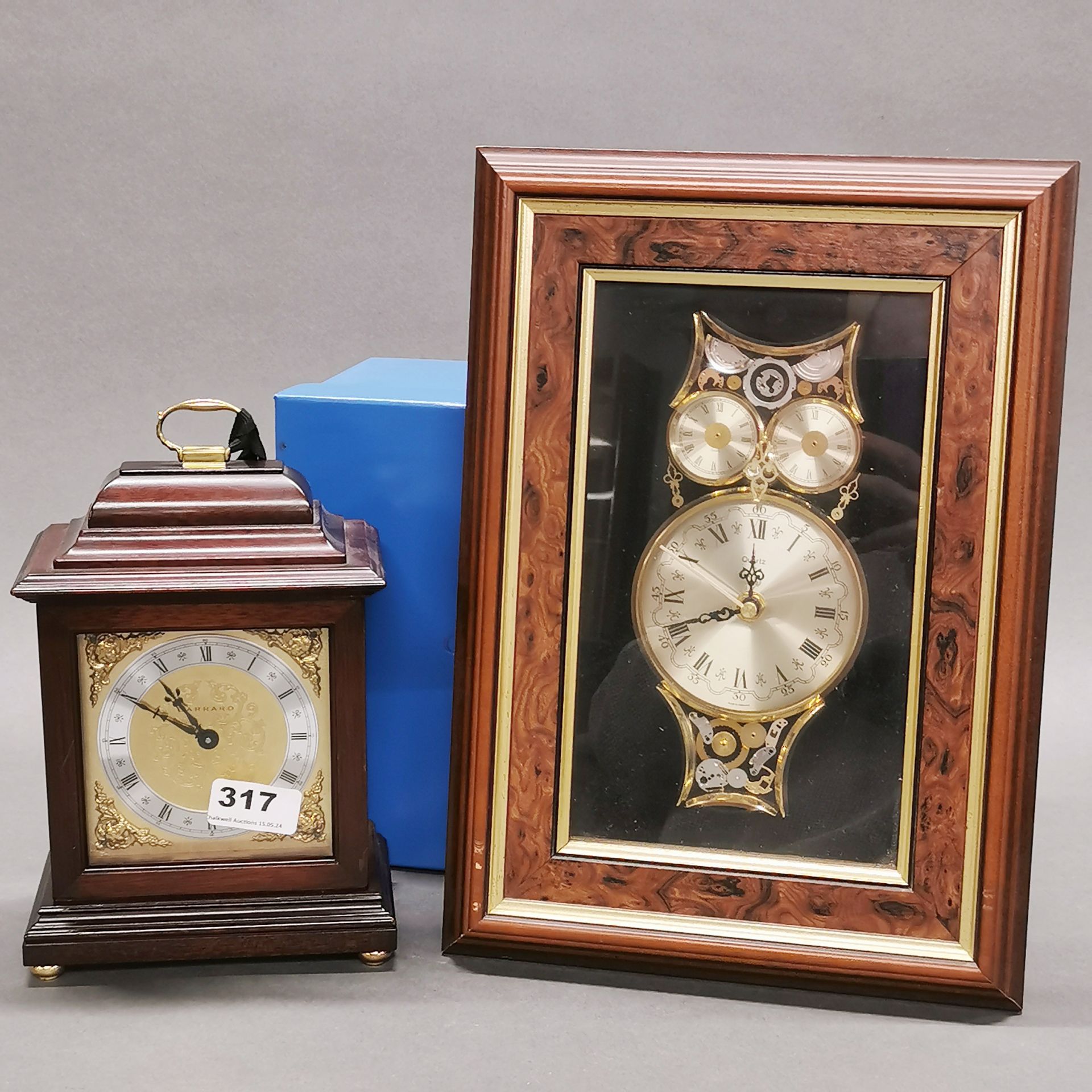 A Garrard mahogany mantel clock with box, H. 24cm. Together with a battery operated wall clock.