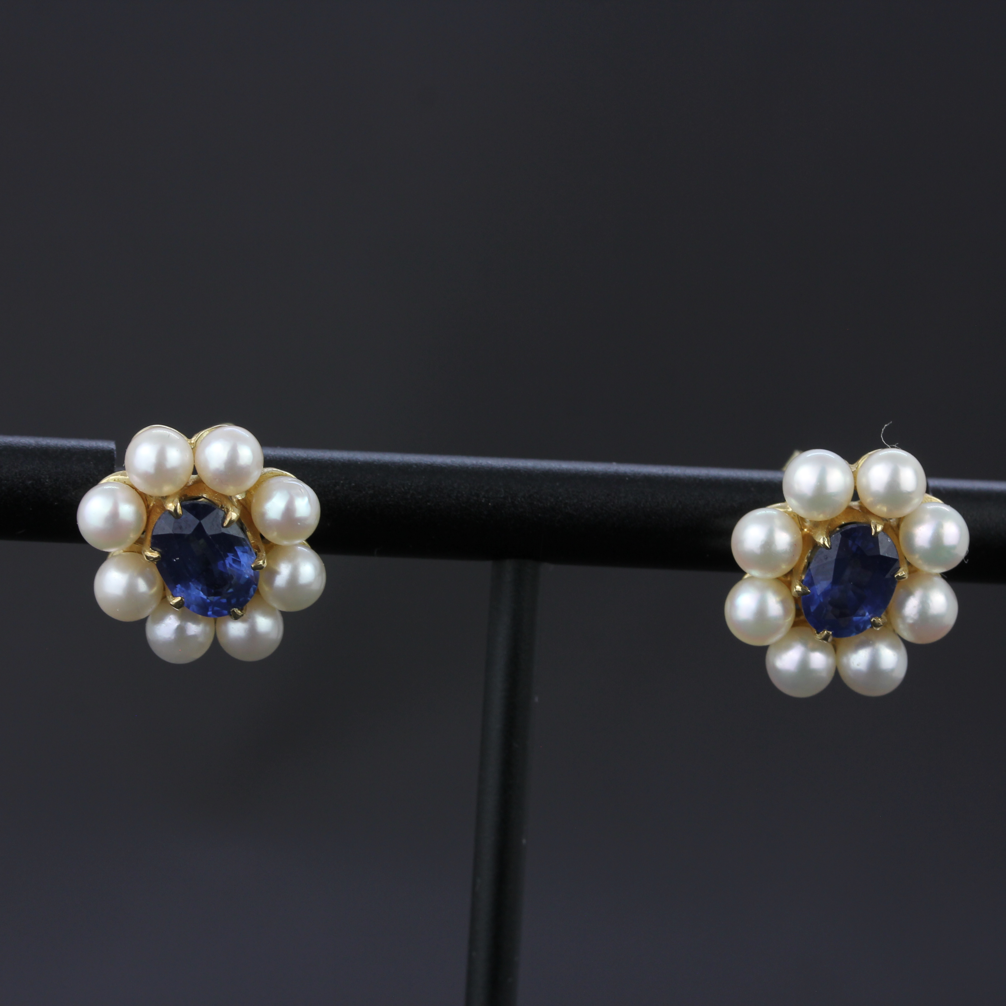 A pair of 9ct yellow gold earrings set with oval cut sapphires surrounded by pearls, L. 1.3cm. - Image 2 of 4