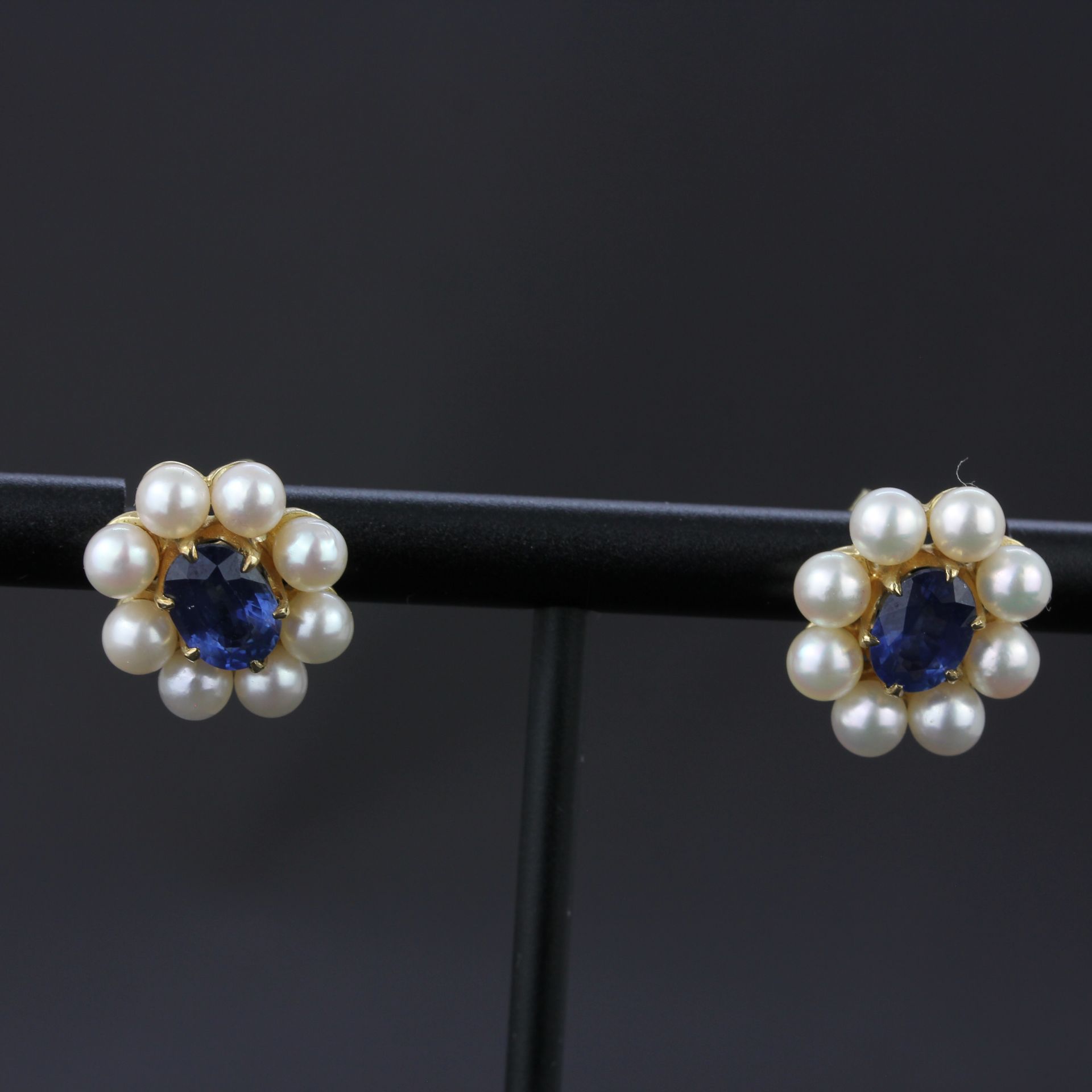 A pair of 9ct yellow gold earrings set with oval cut sapphires surrounded by pearls, L. 1.3cm. - Image 2 of 4