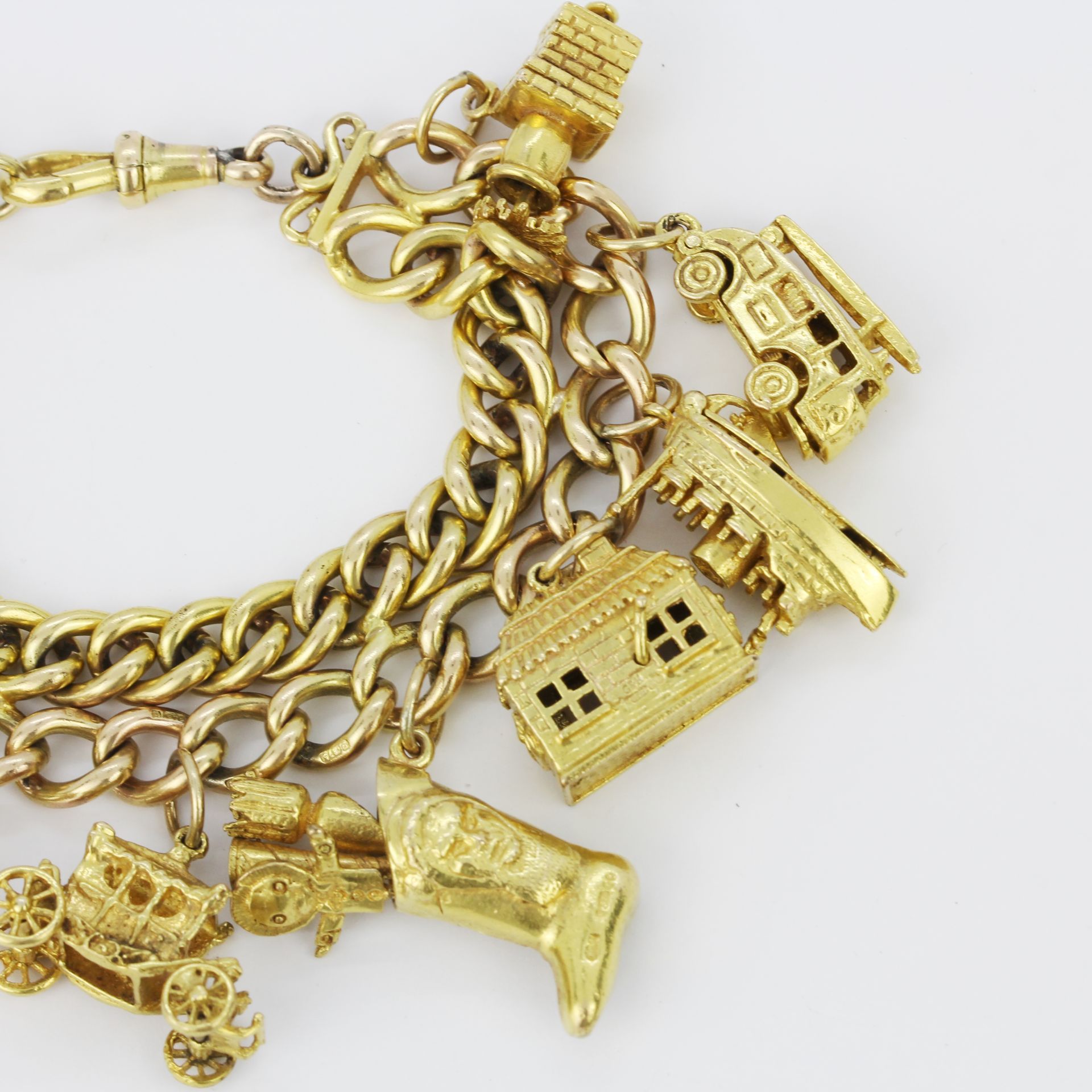 A 9ct yellow gold charm bracelet, L. 18cm. - Image 2 of 5