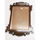 A Regency carved wooden wall mirror, H. 84cm.