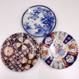 Three large Japanese porcelain chargers, largest 47cm. (1 A/F)