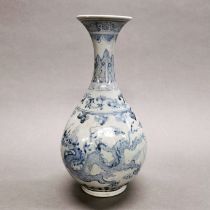 A Chinese provincial hand painted porcelain vase, decorated with dragons, H. 27cm.