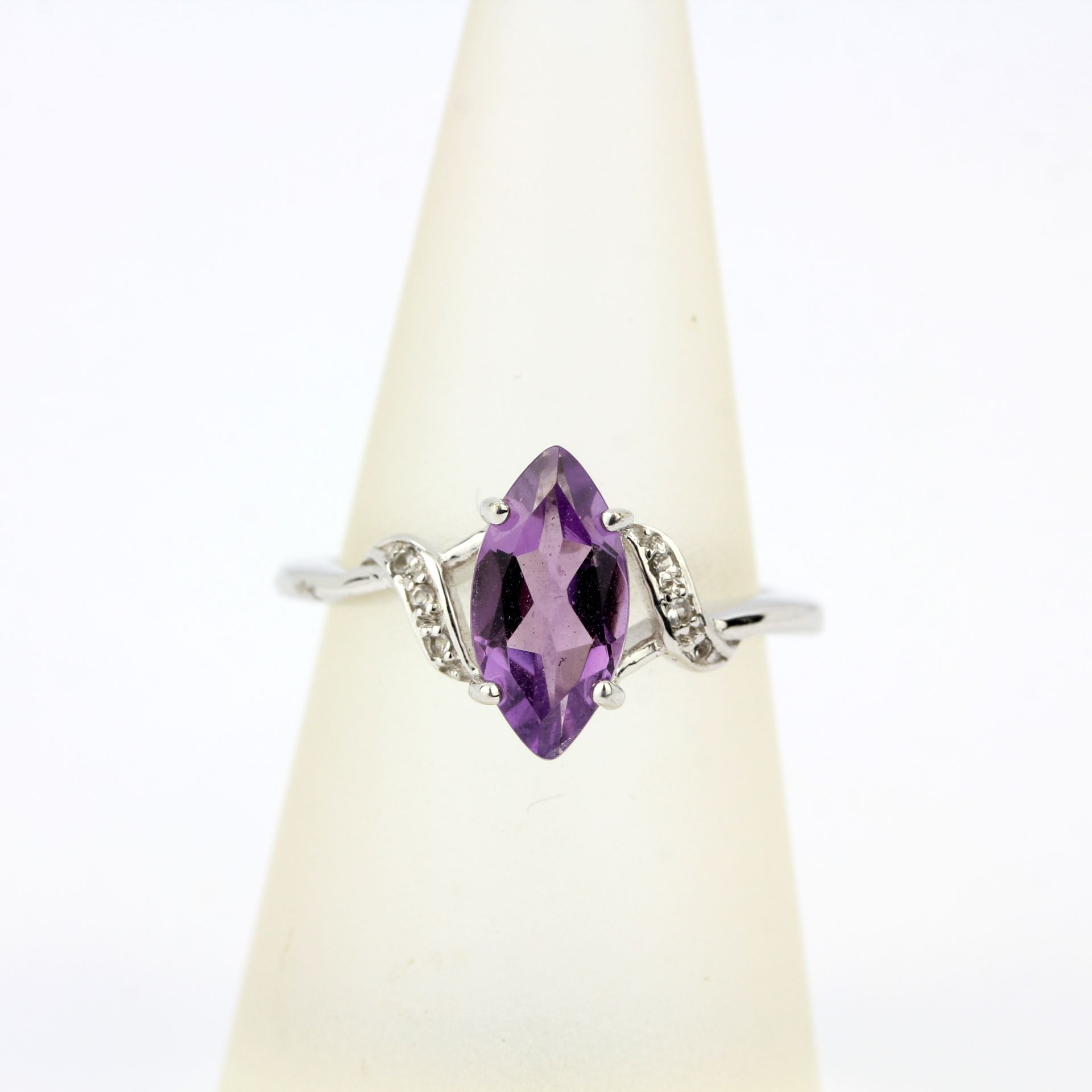 A 9ct white gold ring set with a marquise cut amethyst and diamonds, ring size N.5. - Image 3 of 3