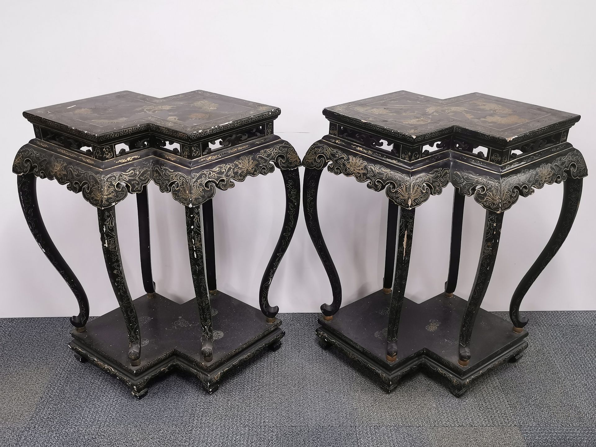 A pair of interesting Chinese lacquered carved wood stands, W. 86cm, H. 90cm.