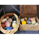 A collection of mixed polished stone eggs, largest 7.5cm.