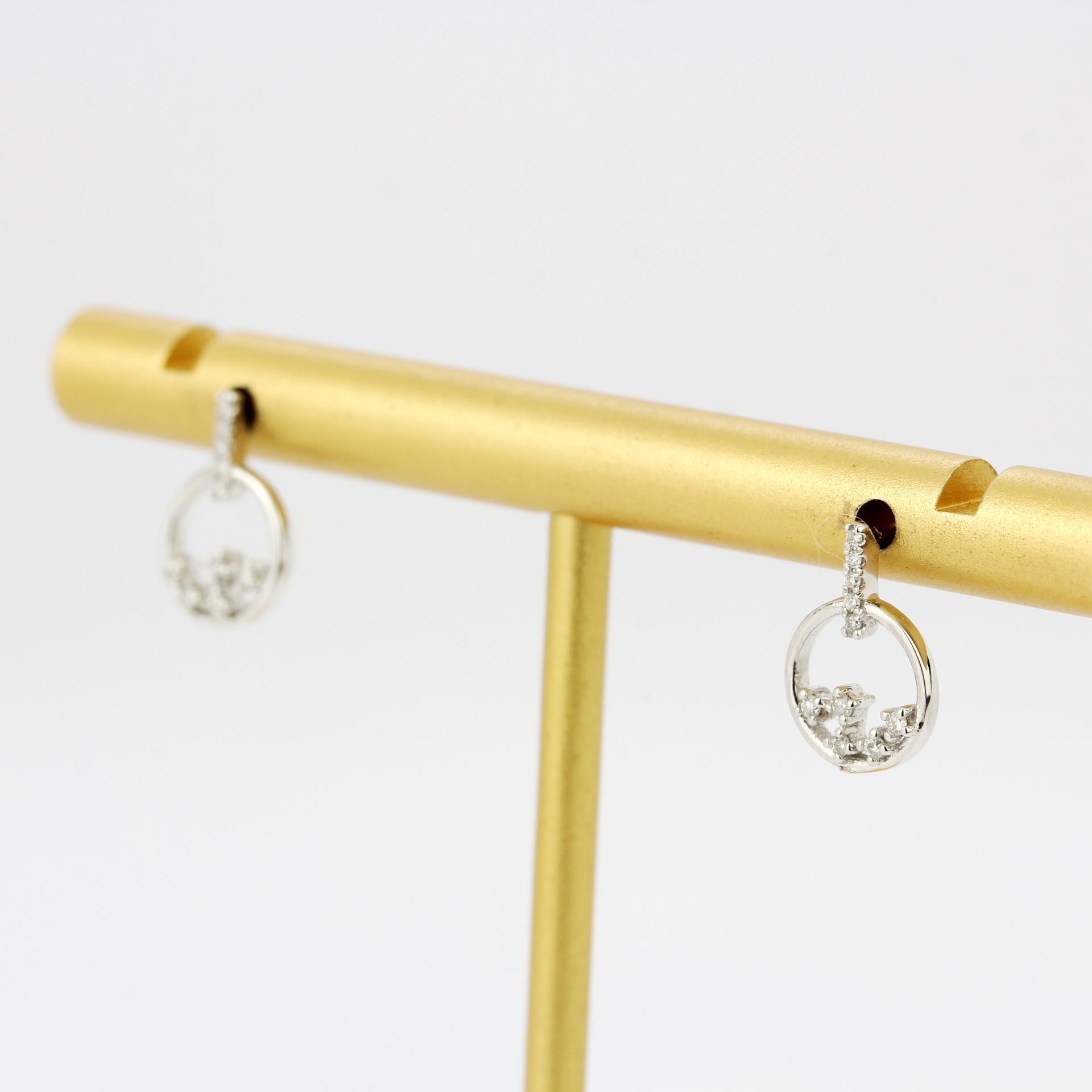 A pair of 9ct white gold diamond set earrings, L. 1.1cm. - Image 2 of 3