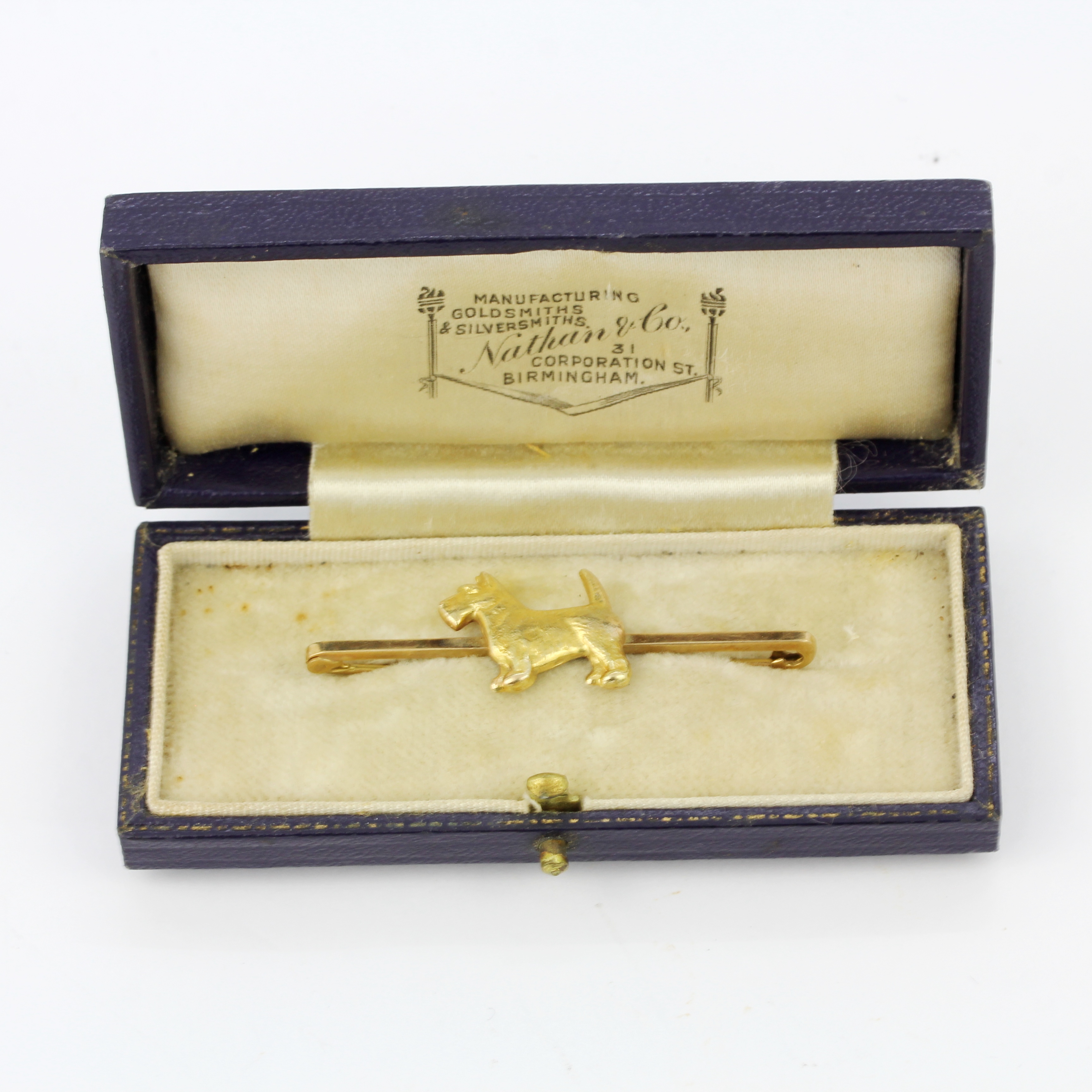 A 9ct yellow gold terrier shaped bar brooch on an antique brooch box, L. 5cm.