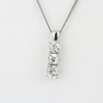 An 18ct white gold (tested) pendant set with three old cut diamonds, approx. 2ct overall, clarity P,