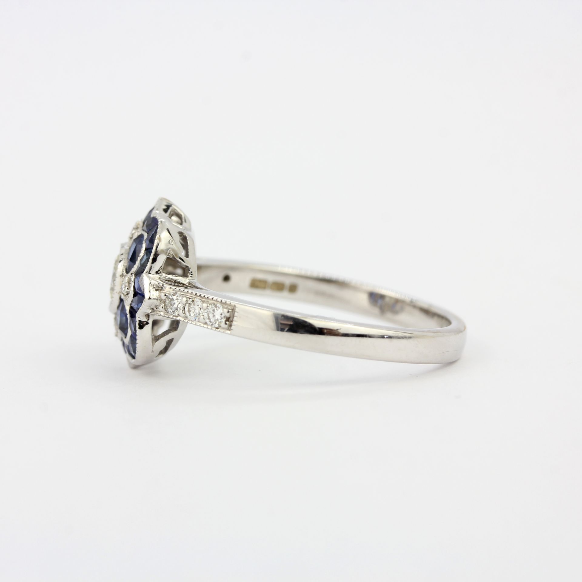 An 18ct white gold Art Deco style ring set with fancy cut sapphires and diamonds, ring size P. - Image 3 of 3