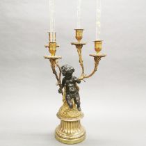 A 19th century gilt bronze Putti candelabrum, H. 50cm.